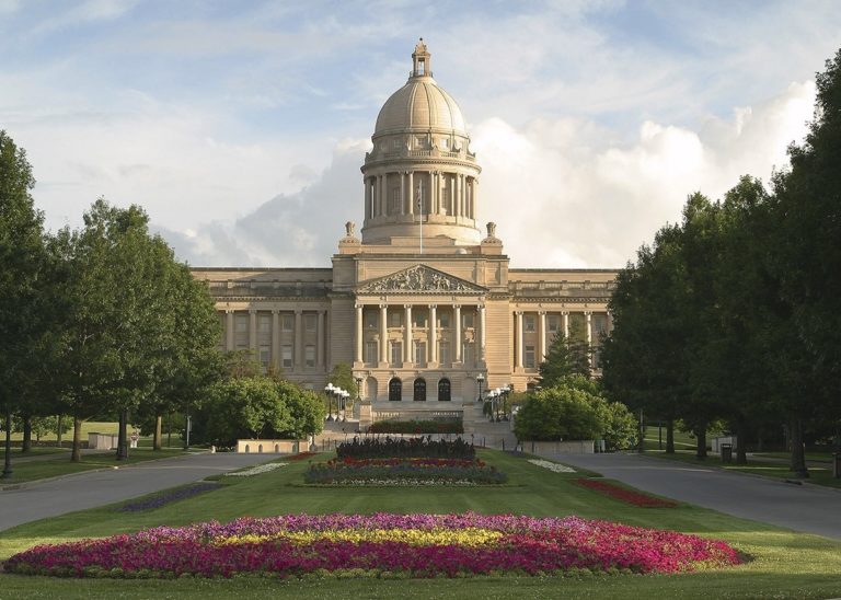 Exterior image of the KY State Capitol Building with the red and yellow tulips in front