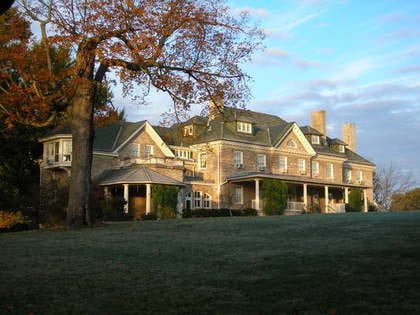 exterior shot of mansion on a hill