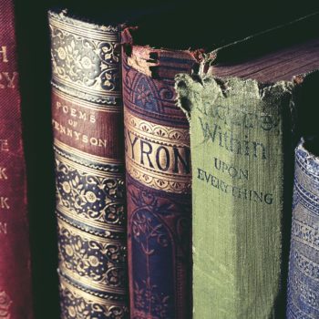 close-up image of 4 weathered books
