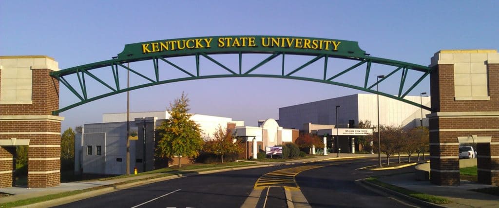 entering KY State University , showing overhead gateway and guardhouse