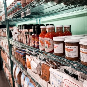 Jars of sauces, butters, jams, etc for sale at Locals Food Hub and Pizza Pub