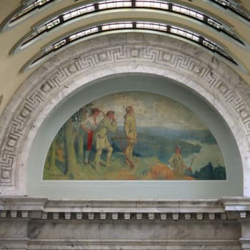 A mural of pioneers in the State Capitol building.