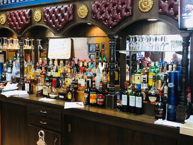 image of a full bar with assorted adult beverages