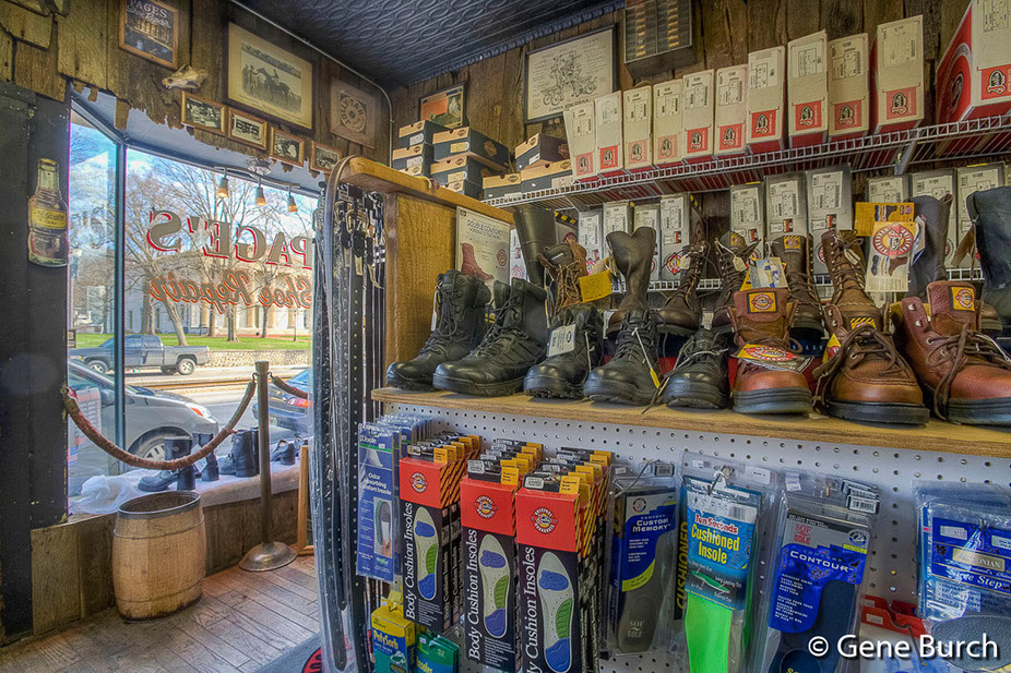 interior shot of shoes for sale, insoles, and the window in the background