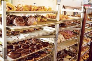 Glass case filled with a variety of donuts