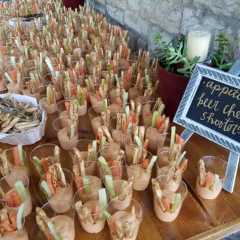 Appetizer table at event, beer cheese shooters