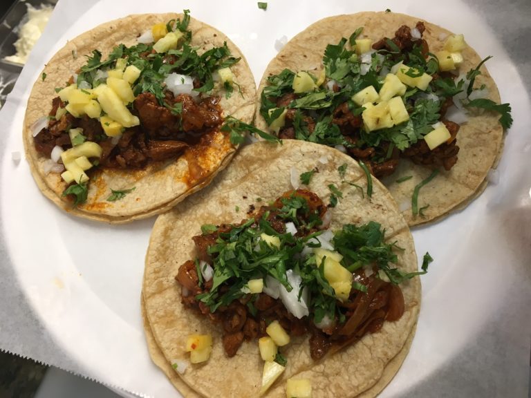 image of three tortillas with beef and cheese and toppings